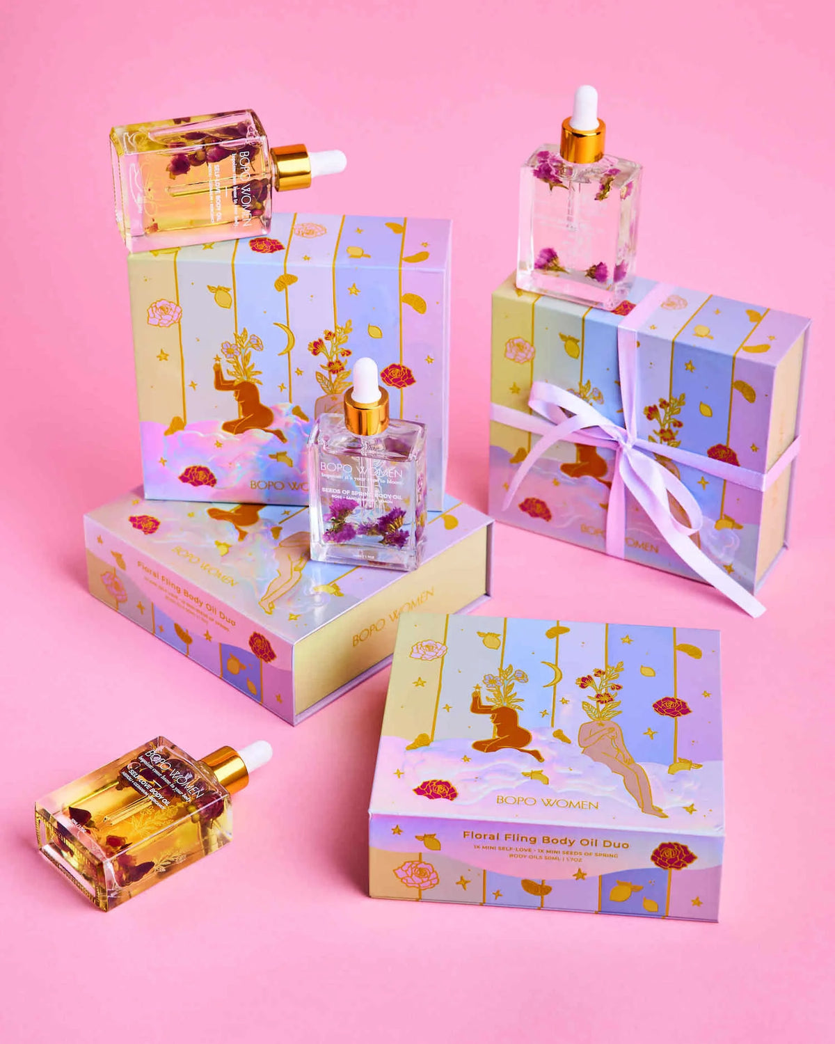 Set of decorative boxes and bottles with a Winnie the Pooh design on a pink background
