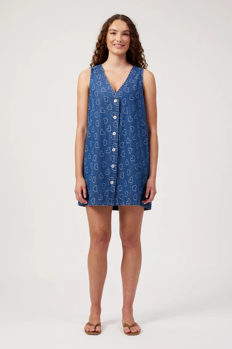sleeveless blue button-front dress with a white heart pattern