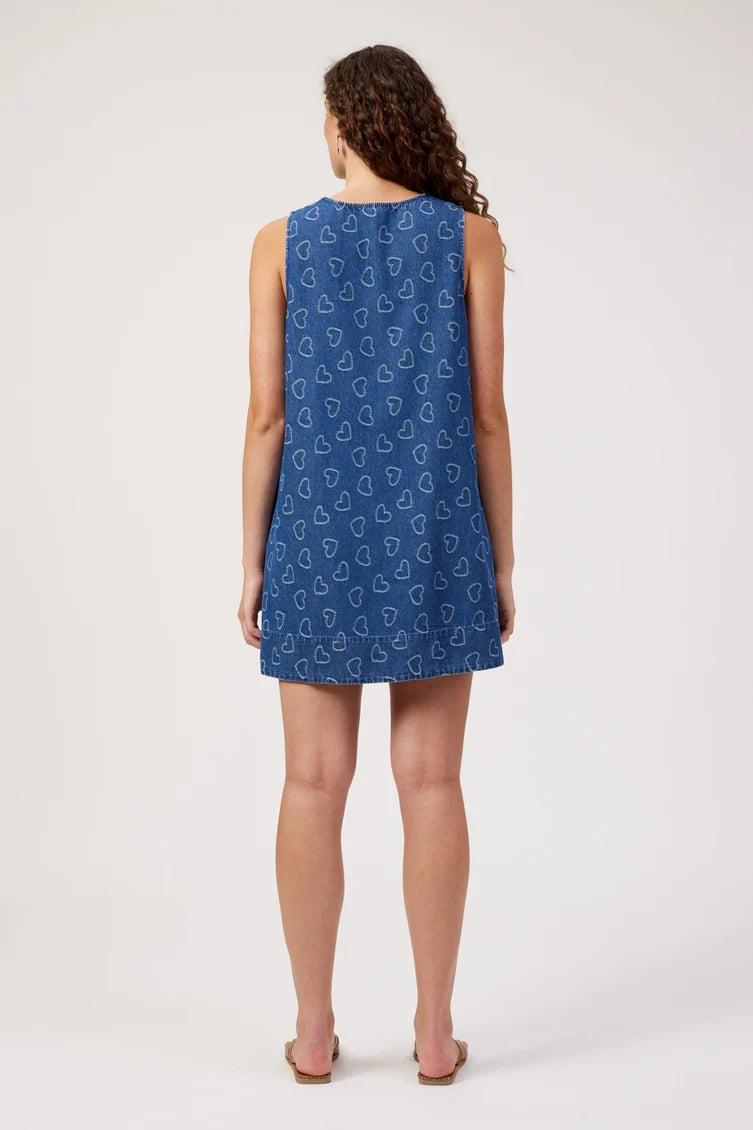 sleeveless blue tunic dress with a repeating white heart pattern