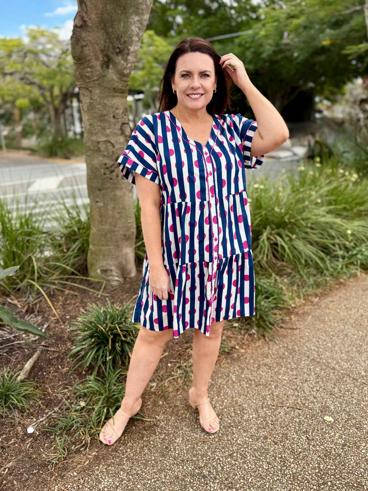 short-sleeve tiered dress with vertical navy, white, and pink stripes 