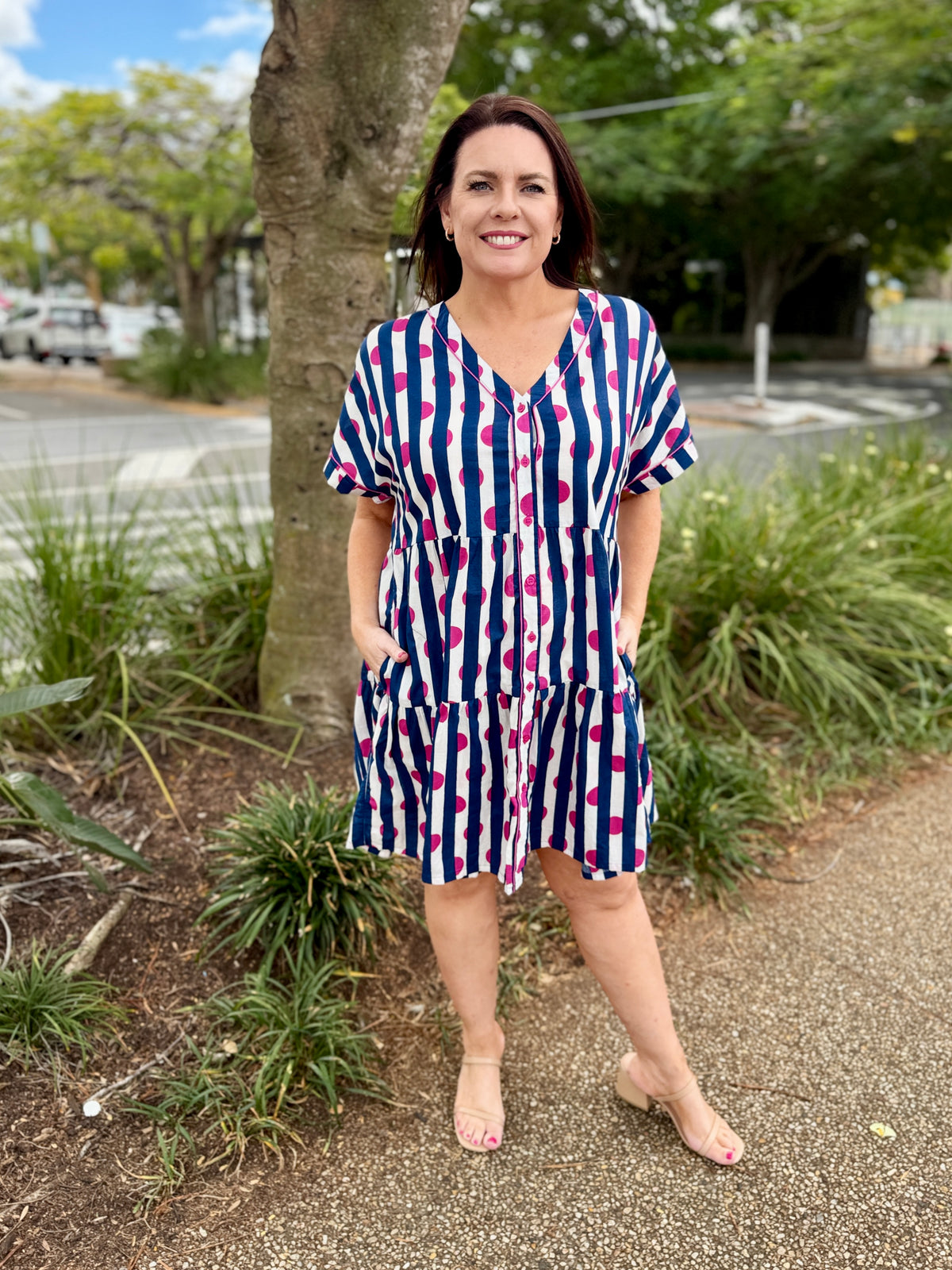 short-sleeve tiered dress with vertical navy, white, and pink stripes, 