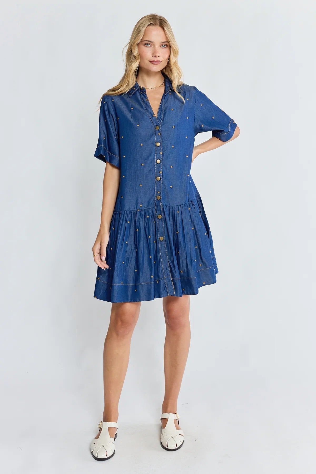 Ibisa River Dress in indigo blue with gold dot print and button front