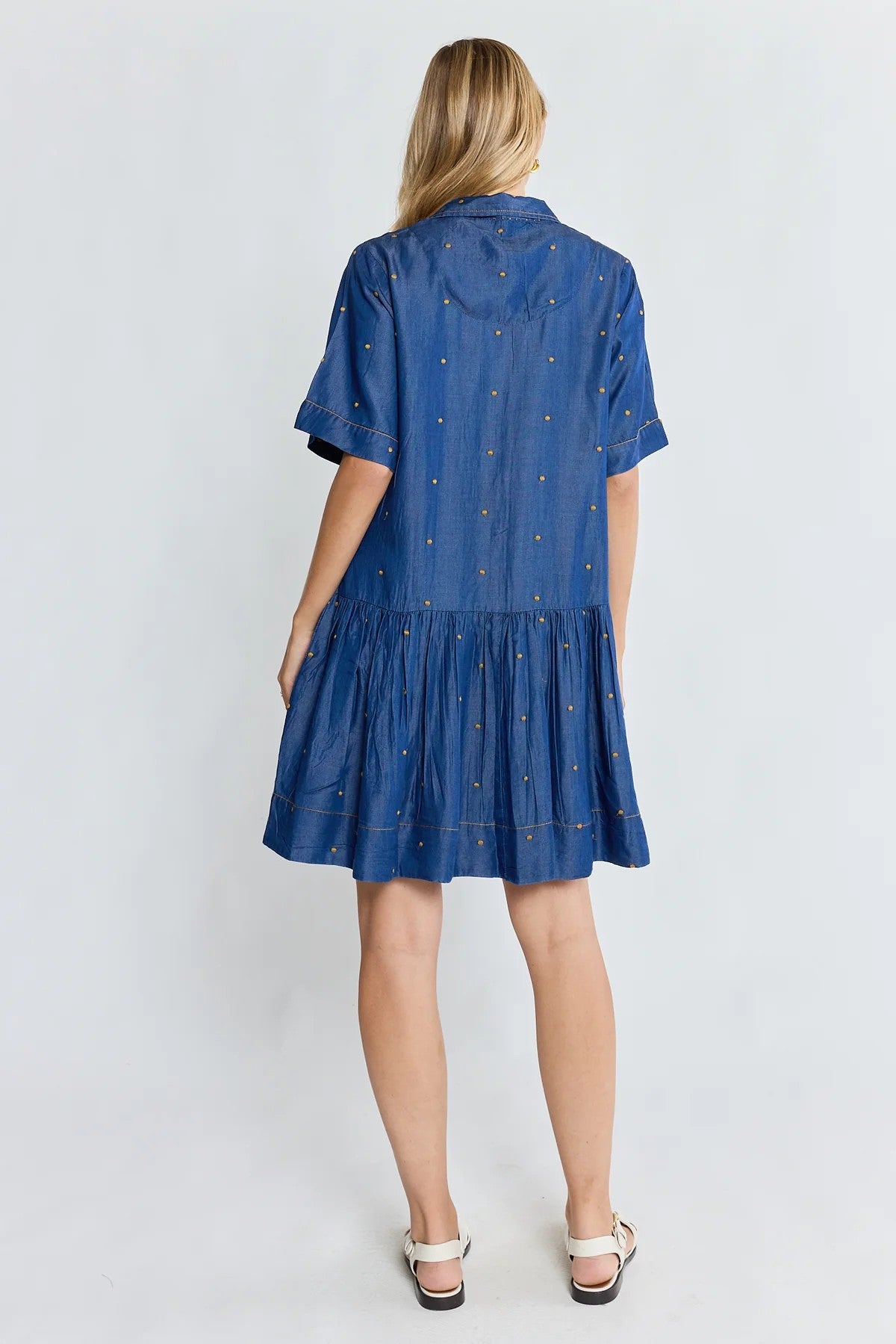 Ibisa River Dress in indigo blue with gold dot print and button front